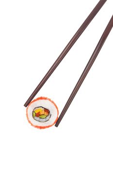 Holding a california maki sushi piece with chopsticks isolated on white background. Culinary gourmet japanese food. 