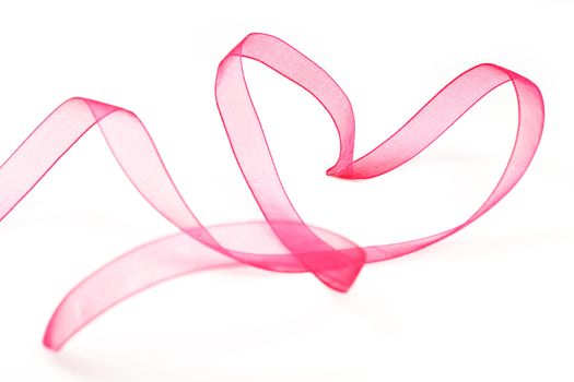 Pink ribbon heart isolated on white background. Valentine love concept.