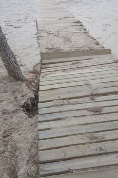 Deep erosion in the sand and broken boardwalk in Camp de Mar, Andratx, Majorca, the day after the big storm of October 29 2013.