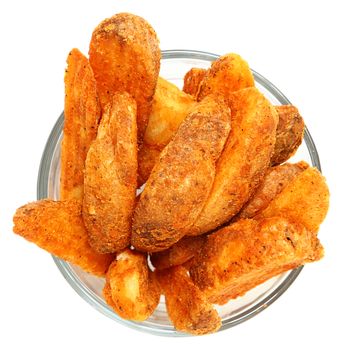Spicy Potato Wedges in Glass Bowl Isolated Over White
