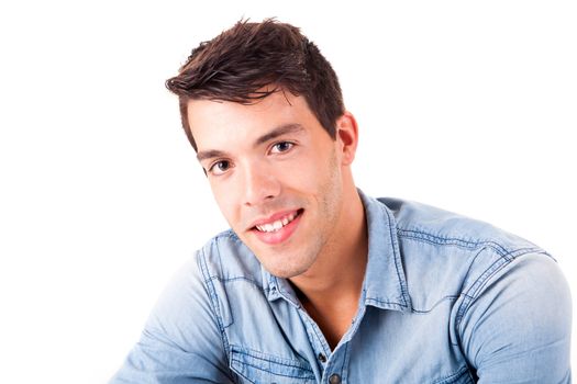 Portrait of handsome young man in casual clothes standing over white background