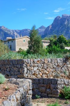 Mountain landscape with house and drystone wall, Majorca in October.