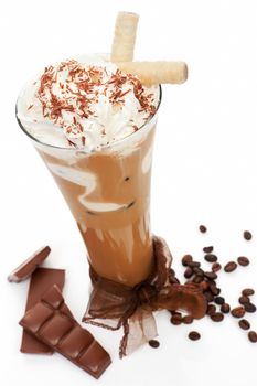 Luxurious delicious iced coffee with foam with chocolate and coffee beans isolated on white. Cool summer drink concept.