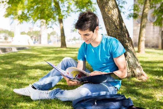 Young student studying at the school garden