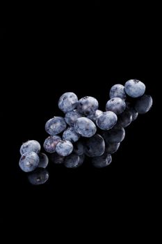 Luxurious blueberry background. Delicious blueberries isolated on black background. Berries in luxurious black.