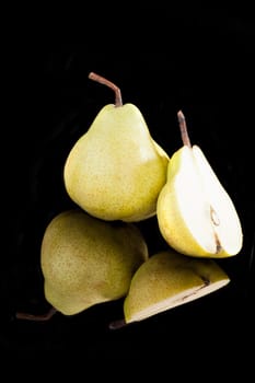 Pear isolated on black background. Healthy summer fruit concept.