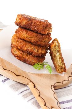 Delicious falafel background. Falafel patty pile on round wooden chopping board. Vegetarian eating.