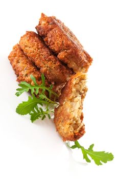 Delicious veggie burger patty with fresh herbs isolated on white background. Culinary vegan eating.