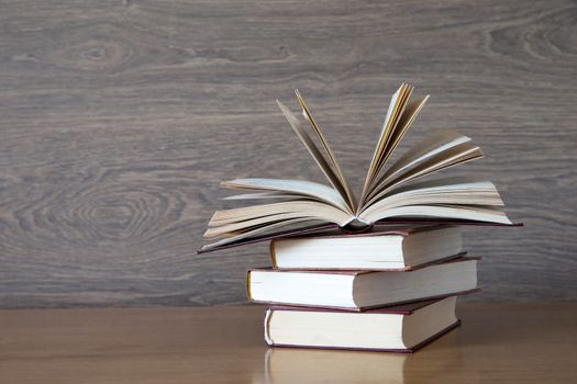 books on wooden deck tabletop