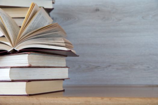 books on wooden deck tabletop