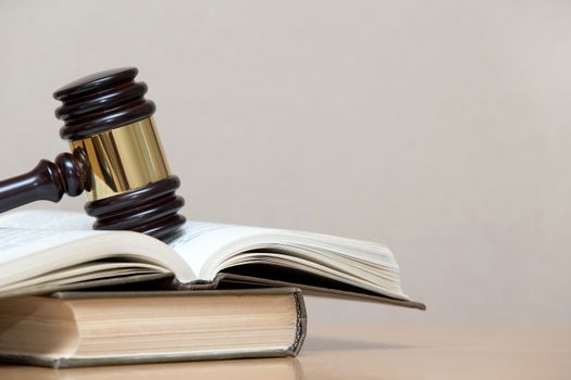 wooden gavel and books on wooden table