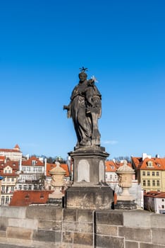 Statue on the Charles Bridge (Karluv most, 1357), a famous historic bridge that crosses the Vltava River in Prague, Czech Republic. Bridge is decorated by 30 statues, originally erected around 1700.