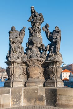 Statue on the Charles Bridge (Karluv most, 1357), a famous historic bridge that crosses the Vltava River in Prague, Czech Republic. Bridge is decorated by 30 statues, originally erected around 1700.