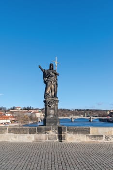 Statue on the Charles Bridge (Karluv most, 1357), a famous historic bridge that crosses the Vltava River in Prague, Czech Republic. Bridge is decorated by 30 statues, originally erected around 1700.