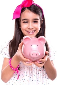 Young girl holding a piggy bank over white background