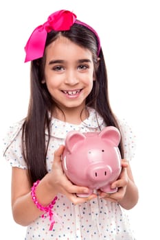 Young girl holding a piggy bank over white background