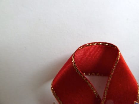 Bright red ribbon with a thin gold border