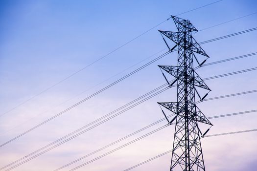 High voltage towers. A high voltage power transmission towers of the main power plant. Into the plant.