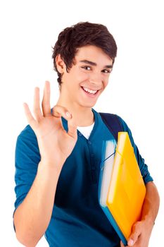 Young happy student showing Ok sign on white background