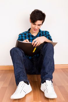 Young man studying at home