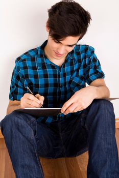 Young man studying at home