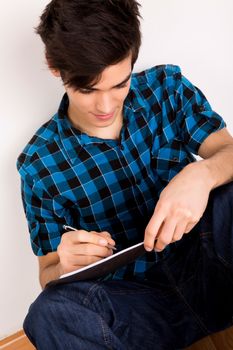 Young man studying at home