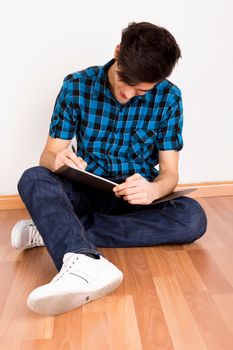 Young man studying at home