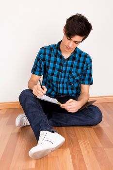 Young man studying at home