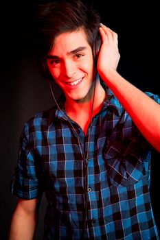 Young and handsome dj with headphones - Disco light effect