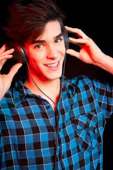 Young and handsome dj with headphones - Disco light effect