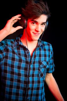 Young and handsome dj with headphones - Disco light effect