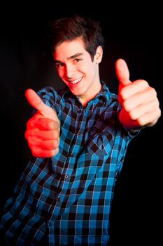 Young man dancing and enjoying music at disco