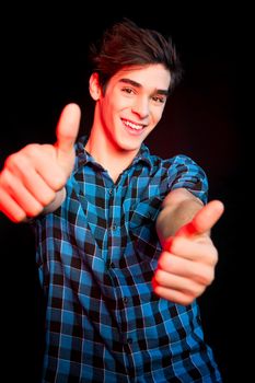 Young man dancing and enjoying music at disco