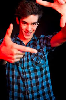 Young man dancing and enjoying music at disco