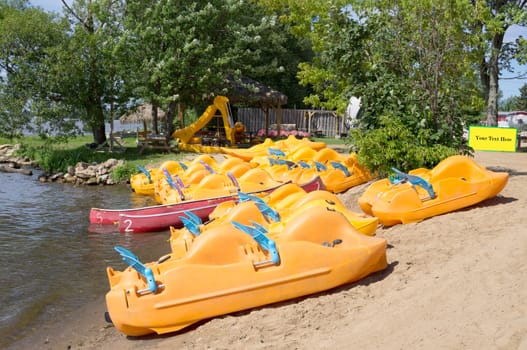 A series of pedalos  at the beach