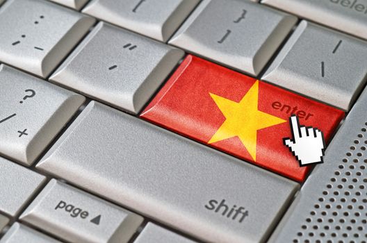 Business concept mouse cursor pressing Vietnam enter key on metallic keyboard