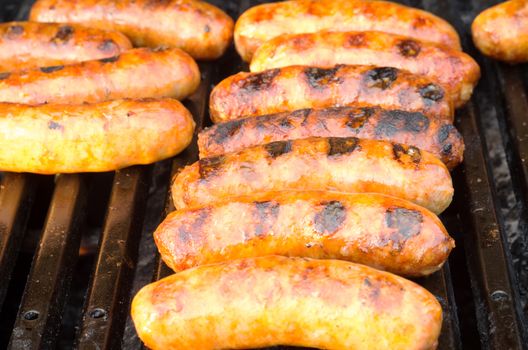 Italian sausages on grill outdoor barbeque