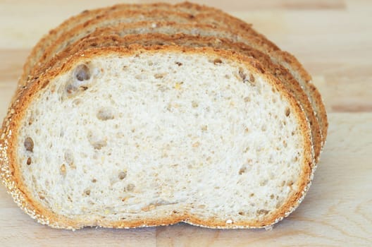 Whole grain sandwich sliced on cutting board