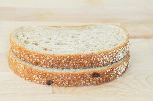 Whole grain sandwich sliced on cutting board