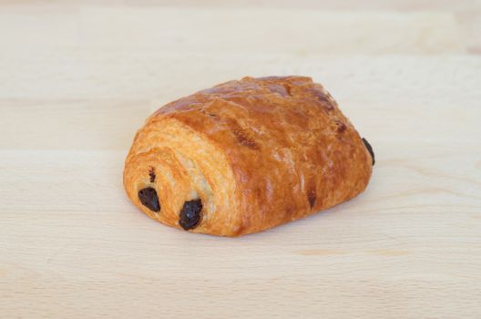 French chocolatine on  wooden cutting board