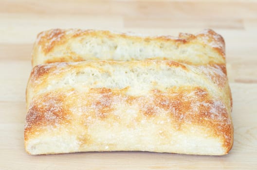 Italian ciabatta bread on cutting board