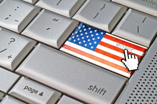 Business concept mouse cursor pressing USA enter key on metallic keyboard