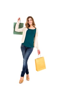 Beautiful woman holding shopping bags over white backgroung