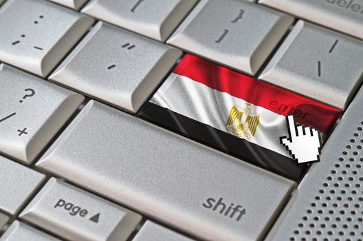 Business concept mouse cursor pressing Egypt enter key on metallic keyboard