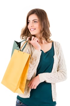 Beautiful woman holding shopping bags over white backgroung