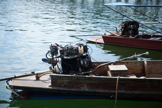 engine of the ship. Motor boats moored in the river.
