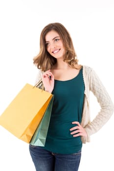 Beautiful woman holding shopping bags over white backgroung