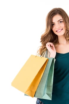 Beautiful woman holding shopping bags over white backgroung