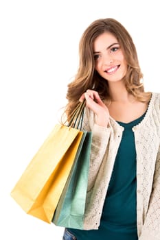 Beautiful woman holding shopping bags over white backgroung