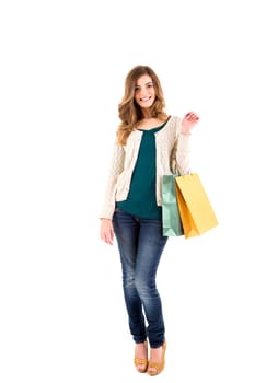 Beautiful woman holding shopping bags over white backgroung